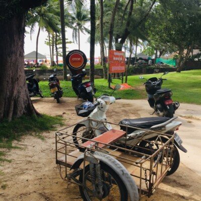 motorcycles parked on the side of a road