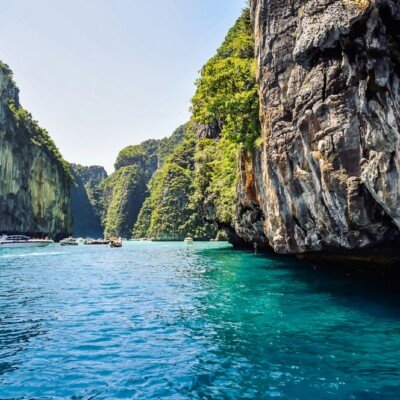 a group of boats floating on top of a body of water