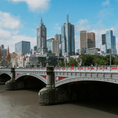 white bridge across city buildings