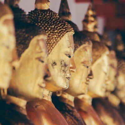 brass Gautama statue in tilt shift photography