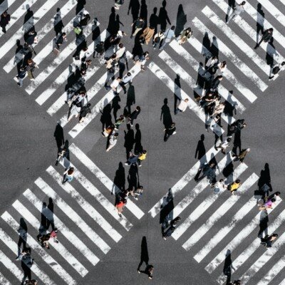 aerial view of people walking on cross pedestrian lane