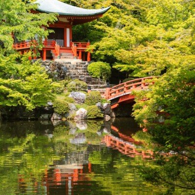red temple near body of water
